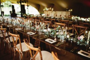 Wedding stretch tent interior with tables and chairs